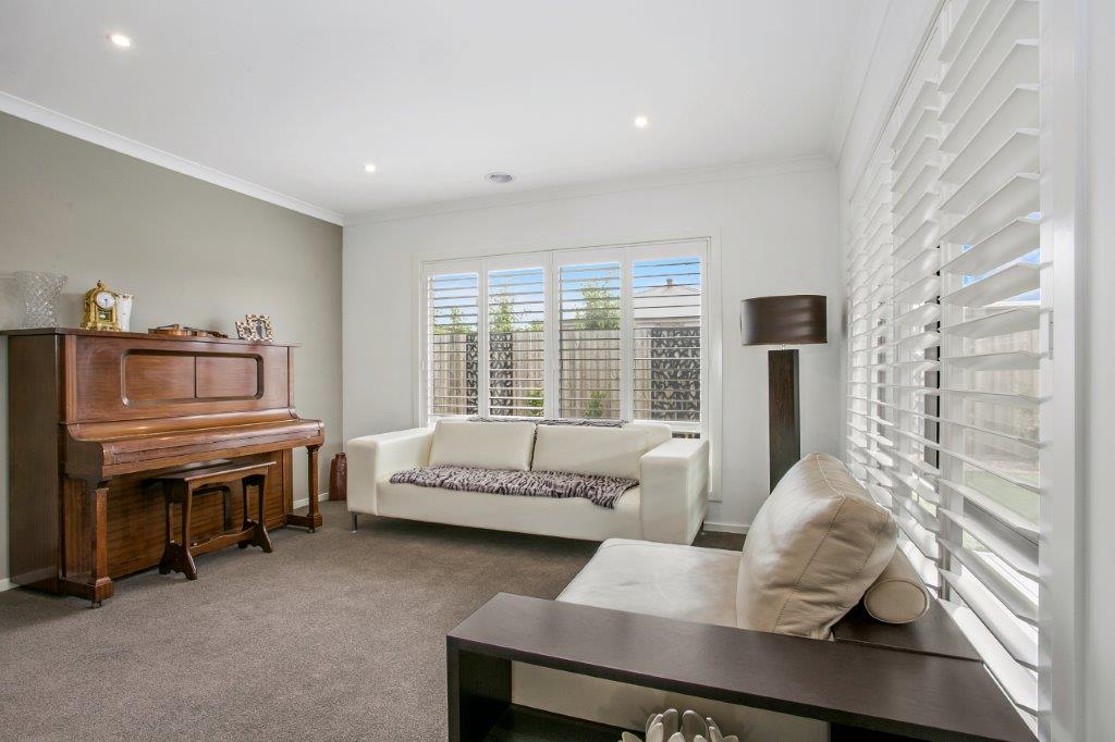 Aluminum Shutters 2 White shutters in a elegant room with piano