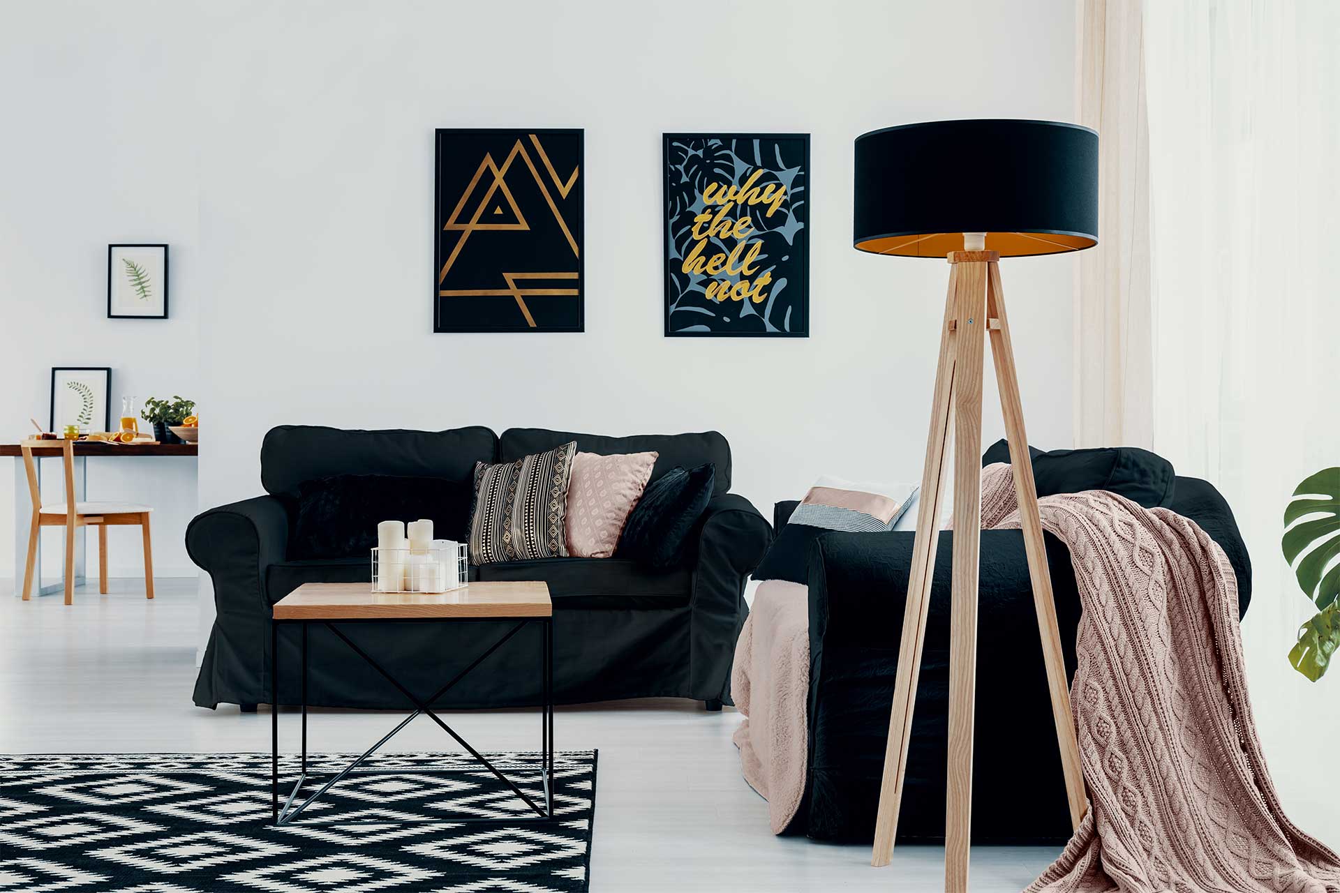 lamp next to dark couch with pink blanket in white H4KZ8LS-harvey-blinds